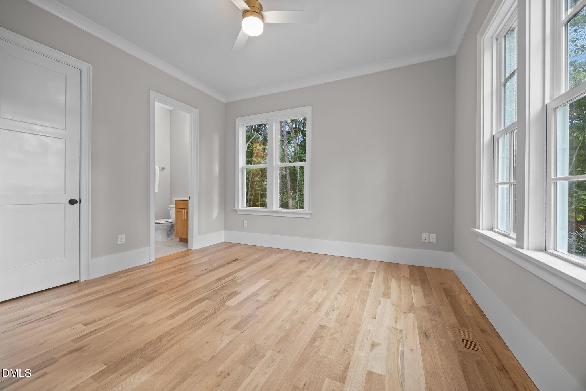 1404 Song Bird Crest Way Raleigh, NC 27613 - Photo 35 of 54 a view of an empty room with wooden floor and a window