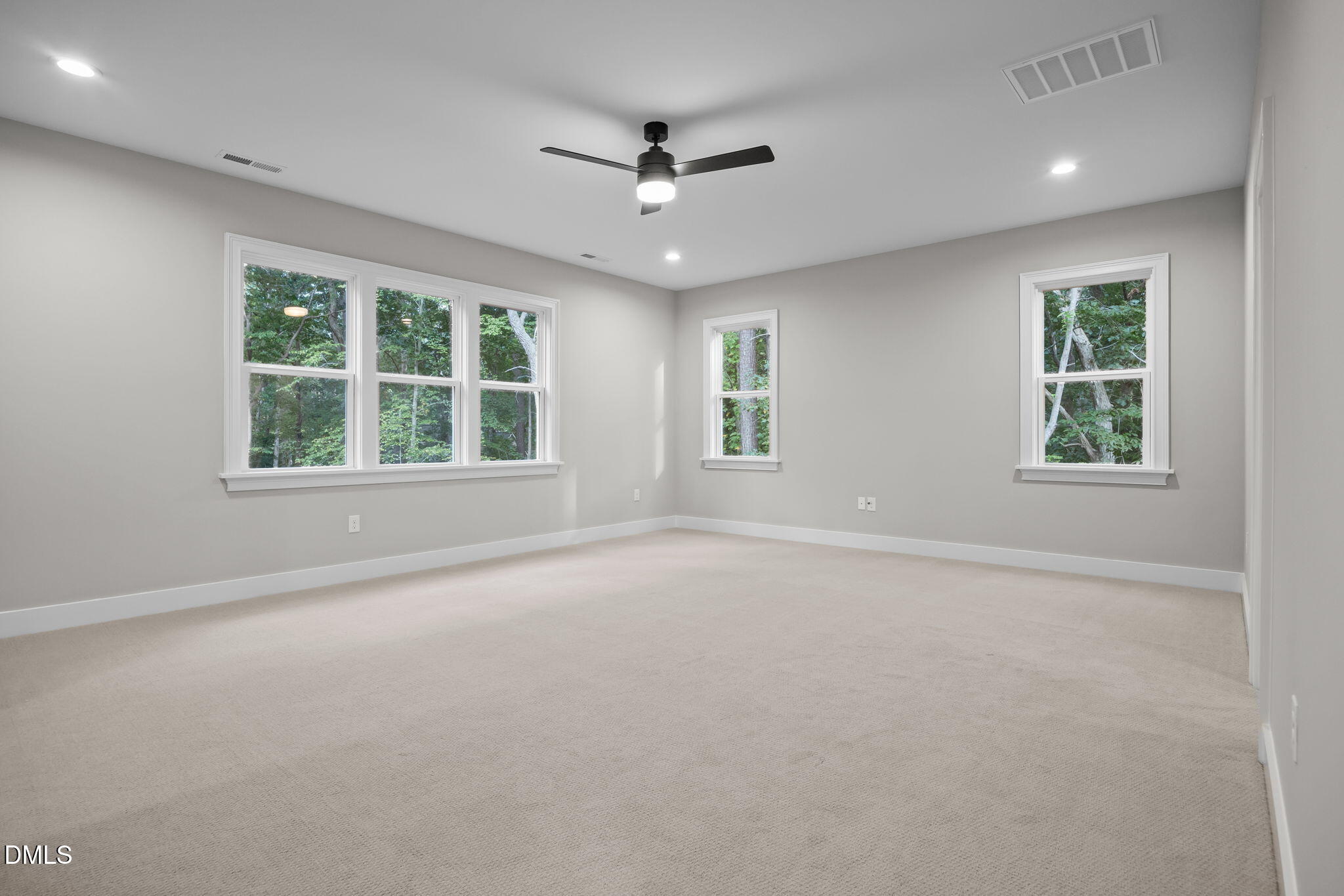 1404 Song Bird Crest Way Raleigh, NC 27613 - Photo 43 of 54 an empty room with windows and ceiling fan