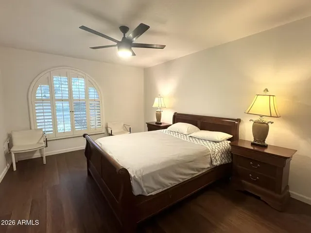 a bedroom with a bed and window