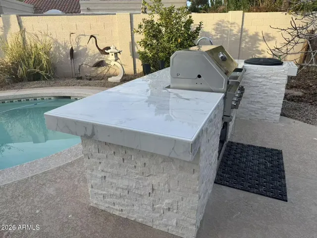 a view of a swimming pool with a sitting area