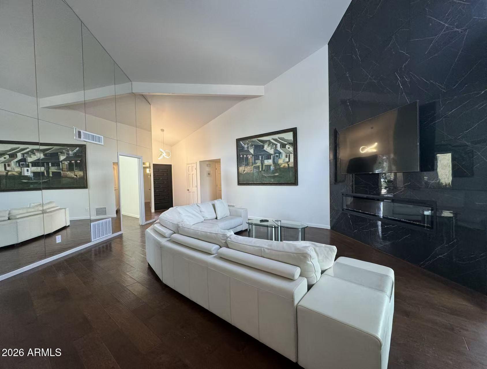 7330 East Griswold Road Scottsdale, AZ 85258 - Photo 3 of 16 a living room with furniture and a wooden floor