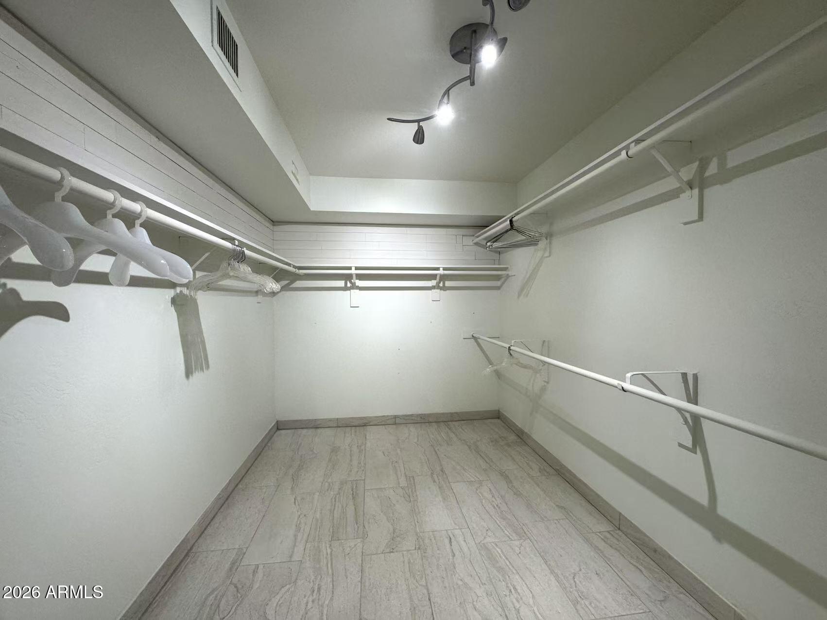 7330 East Griswold Road Scottsdale, AZ 85258 - Photo 6 of 16 a view of a room with racks on the wall