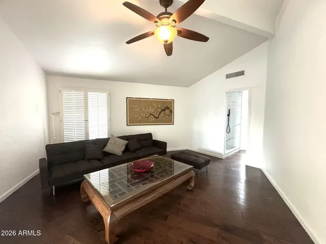 a living room with furniture and a window