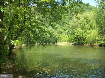 194 View Lane Augusta, WV 26704 - Photo 12 of 25 a view of an ocean with trees in the background