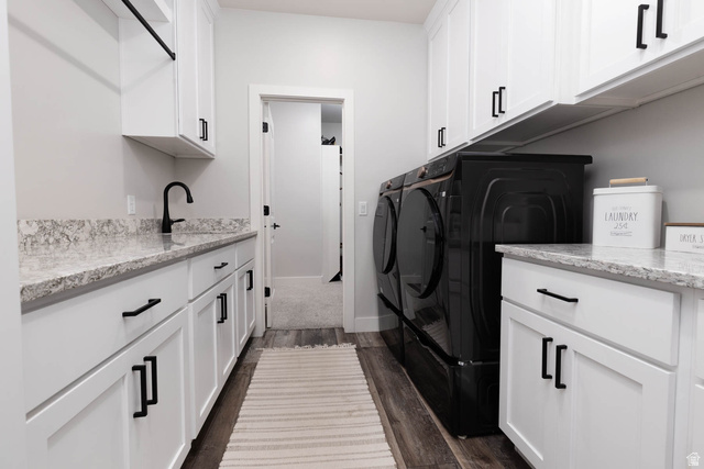 186 West 580 North Redmond, UT 84652 - Photo 29 of 74 Laundry area featuring cabinet space, dark wood finished floors, and washer and dryer