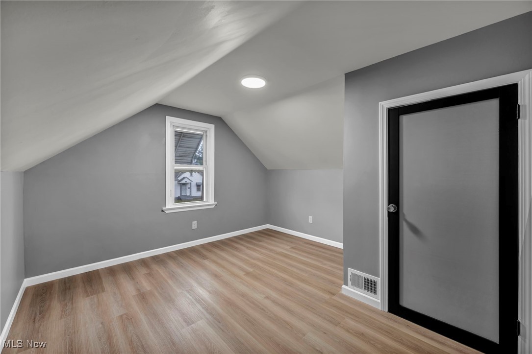 20202 Sumpter Road Cleveland, OH 44128 - Photo 37 of 46 Additional living space with vaulted ceiling and light wood-style floors