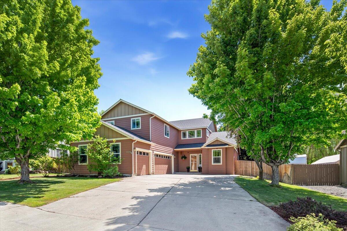 1339 Southwest Rimrock Way Redmond, OR 97756 - Photo 25 of 26 a front view of a house with a garden