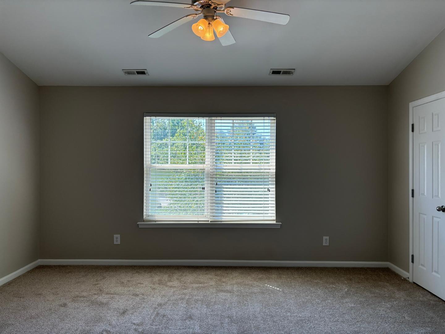 11316 Shadow Elms Lane Raleigh, NC 27614 - Photo 10 of 11 an empty room with a window