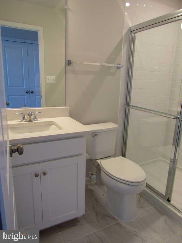 236 Anthem Street Ranson, WV 25438 - Photo 17 of 17 a bathroom with a sink toilet vanity and shower