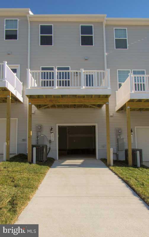 236 Anthem Street Ranson, WV 25438 - Photo 2 of 17 a front view of a building with a garage