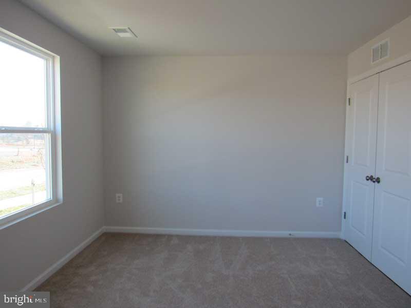 236 Anthem Street Ranson, WV 25438 - Photo 5 of 17 an empty room with a window