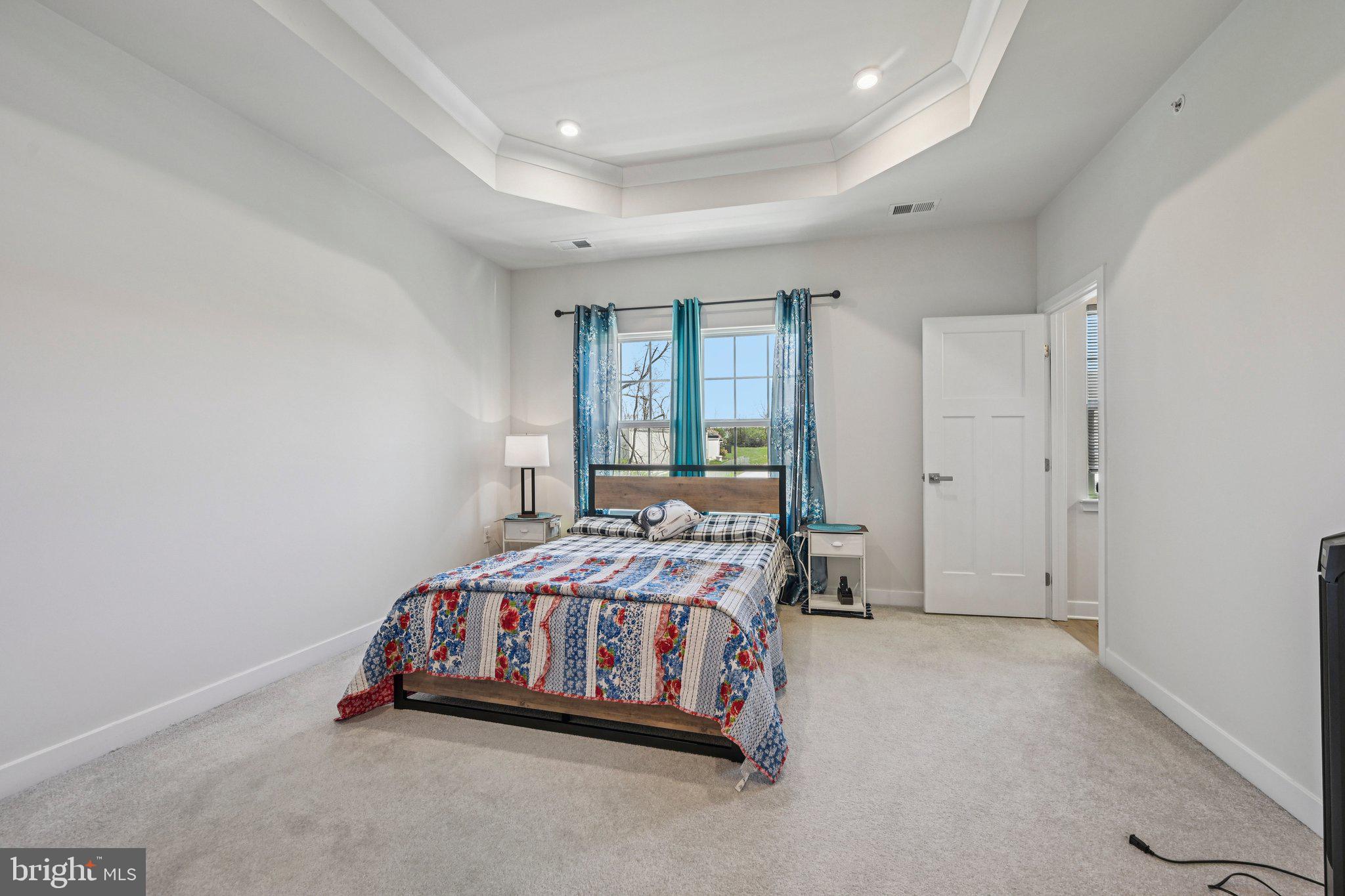 316 Longs Peak Way Exton, PA 19341 - Photo 16 of 31 a bedroom with a bed and a window