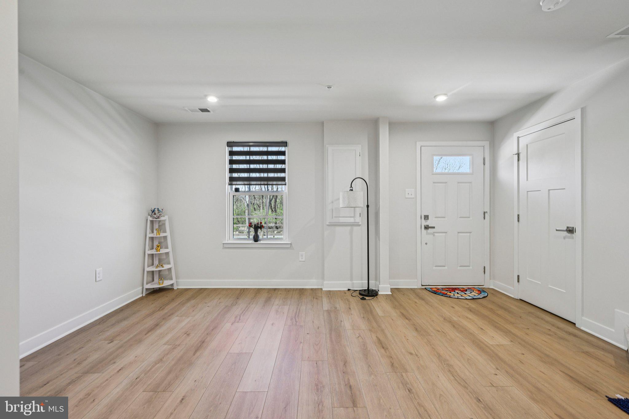 316 Longs Peak Way Exton, PA 19341 - Photo 4 of 31 wooden floor in an empty room with a window