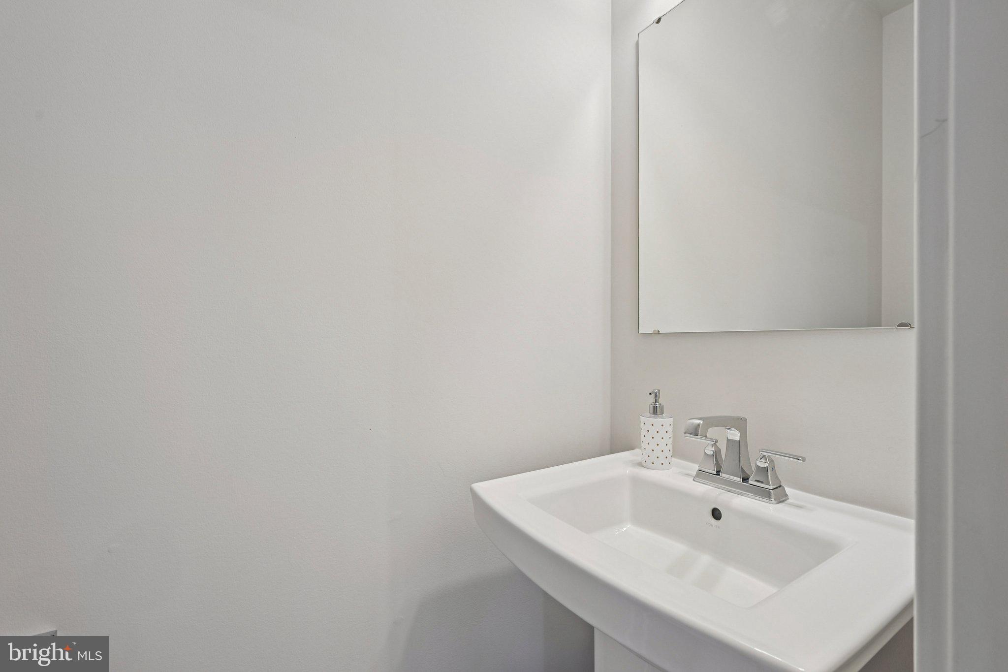 316 Longs Peak Way Exton, PA 19341 - Photo 10 of 31 a bathroom with a sink and a mirror