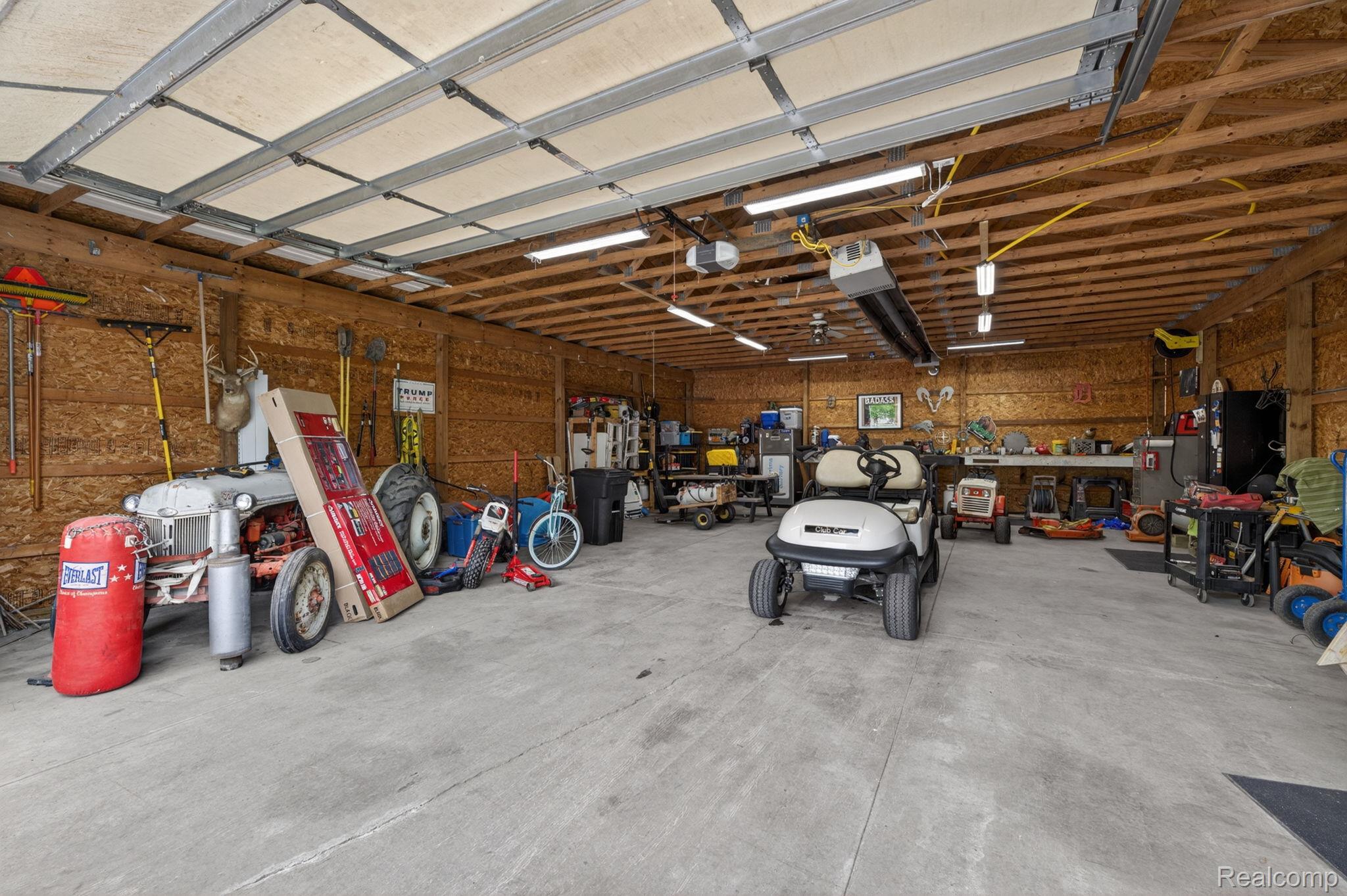 6354 Lapeer Road Burton, MI 48509 - Photo 37 of 44 Garage with a workshop area and a garage door opener