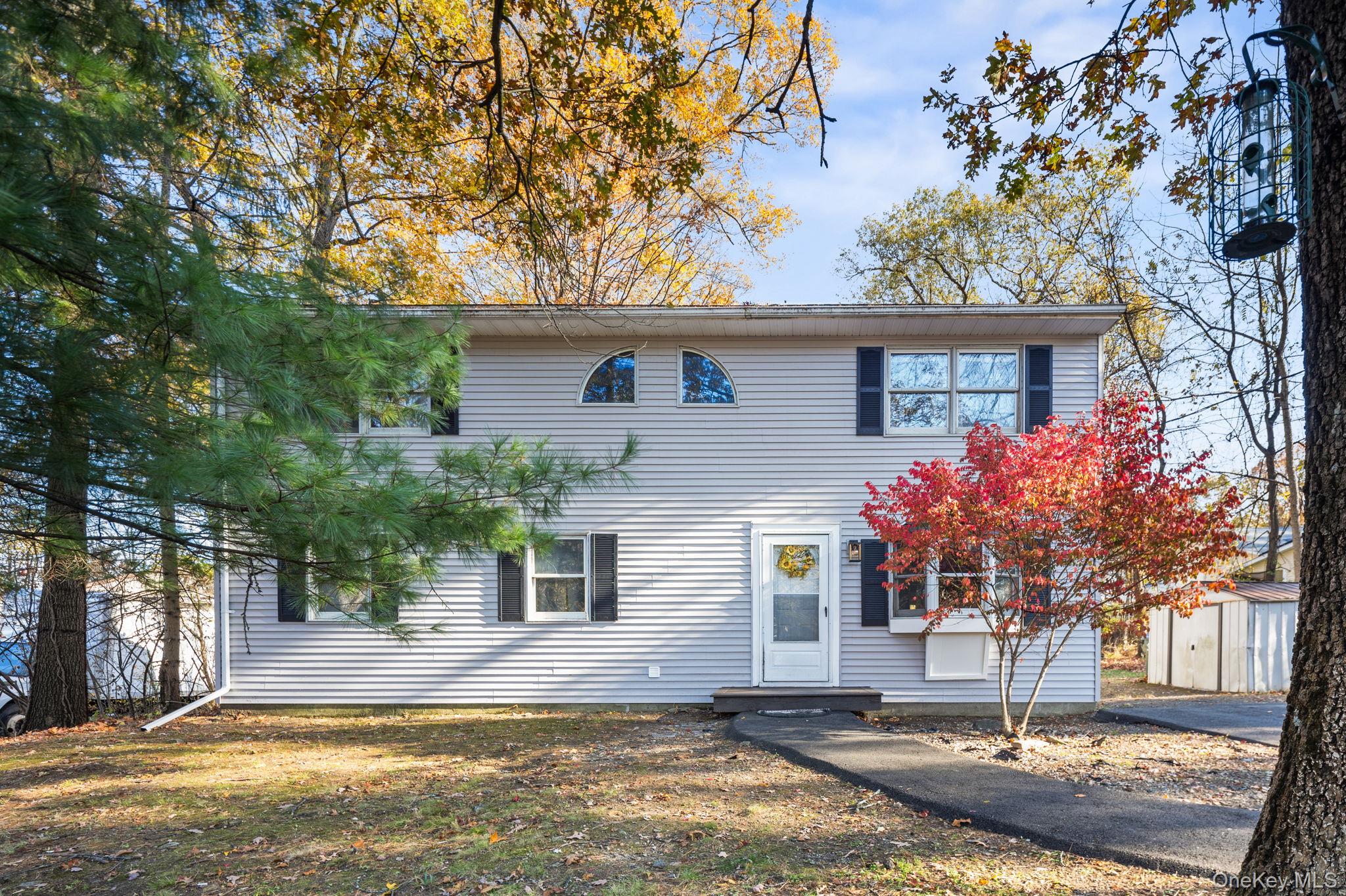 104 Riley Road New Windsor, NY 12553 - Photo 1 of 35 a front view of a house with garden