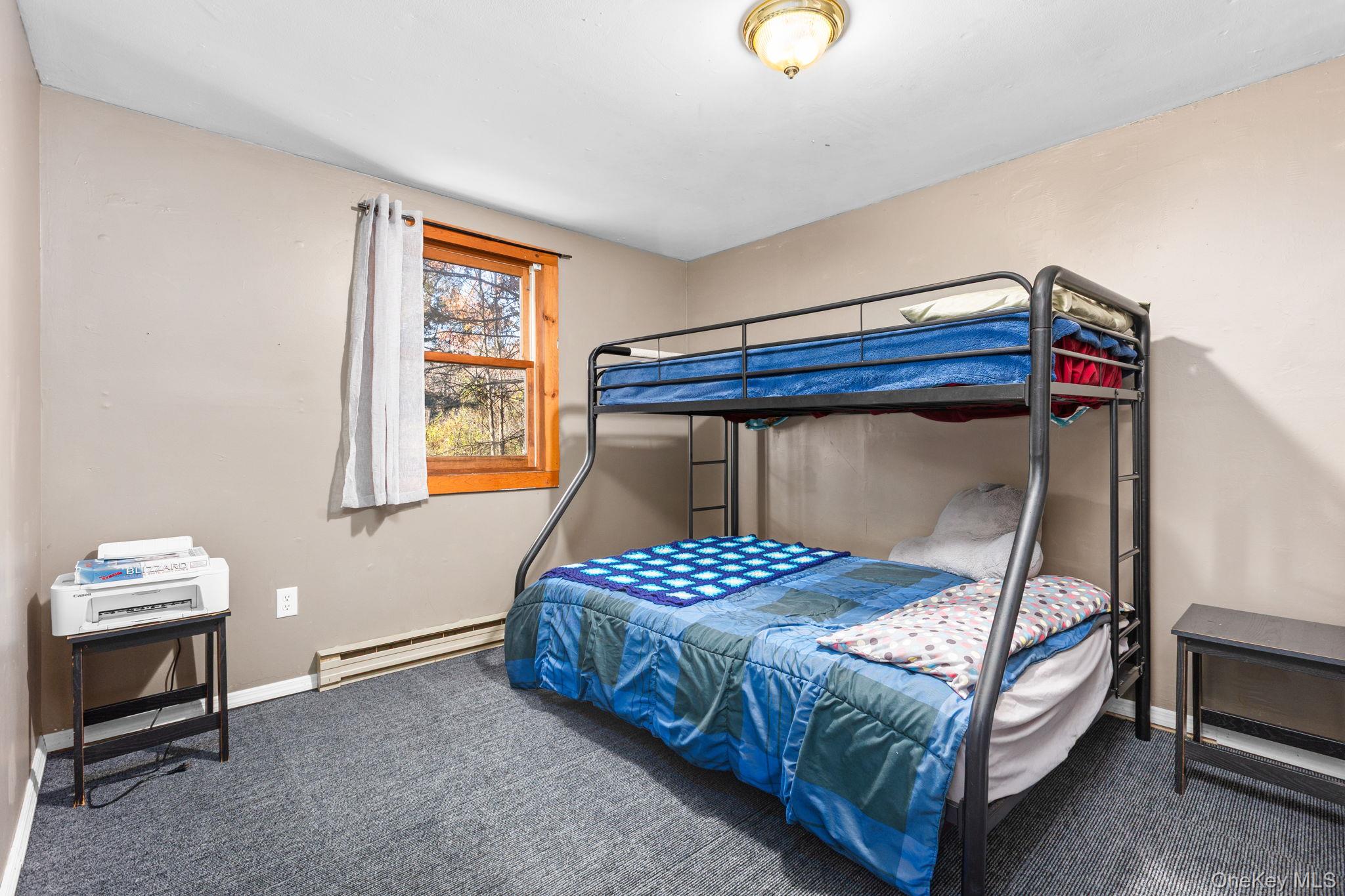 104 Riley Road New Windsor, NY 12553 - Photo 15 of 35 a bedroom with a bed and a window