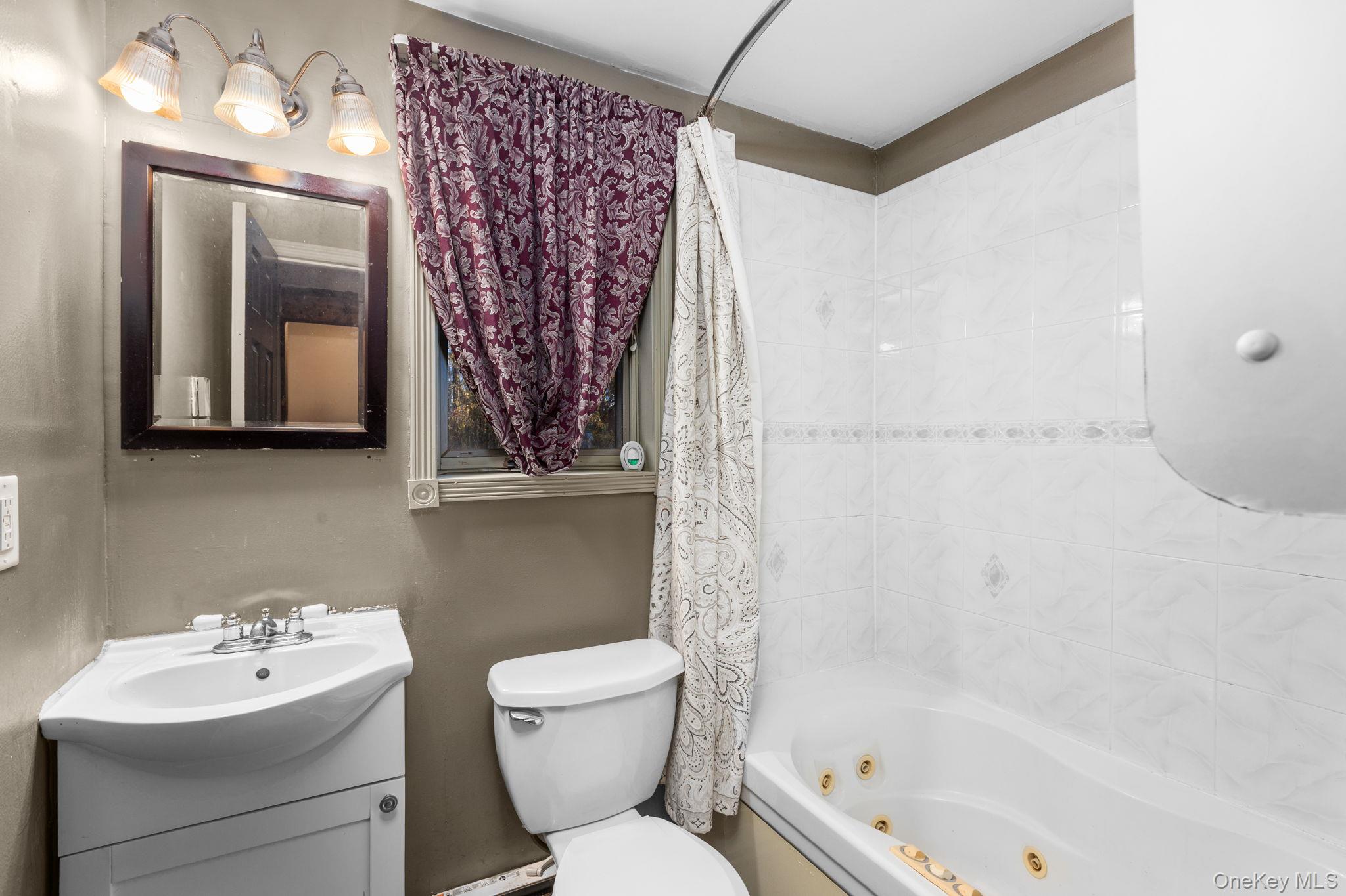 104 Riley Road New Windsor, NY 12553 - Photo 17 of 35 a bathroom with a toilet sink and mirror