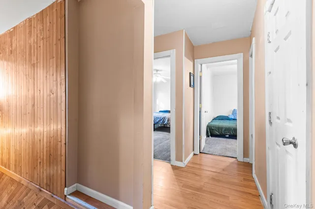a spacious bedroom with a bed and a book shelf