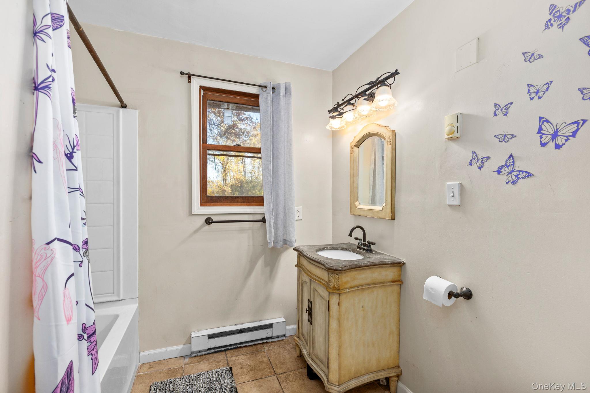 104 Riley Road New Windsor, NY 12553 - Photo 21 of 35 a bathroom with a sink a mirror and a window