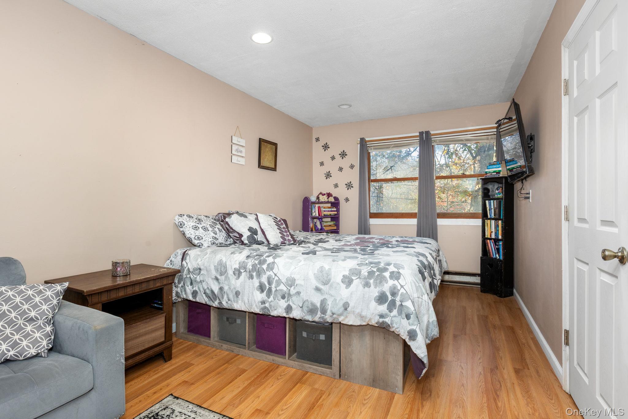 104 Riley Road New Windsor, NY 12553 - Photo 23 of 35 a bed room with a bed and a couch