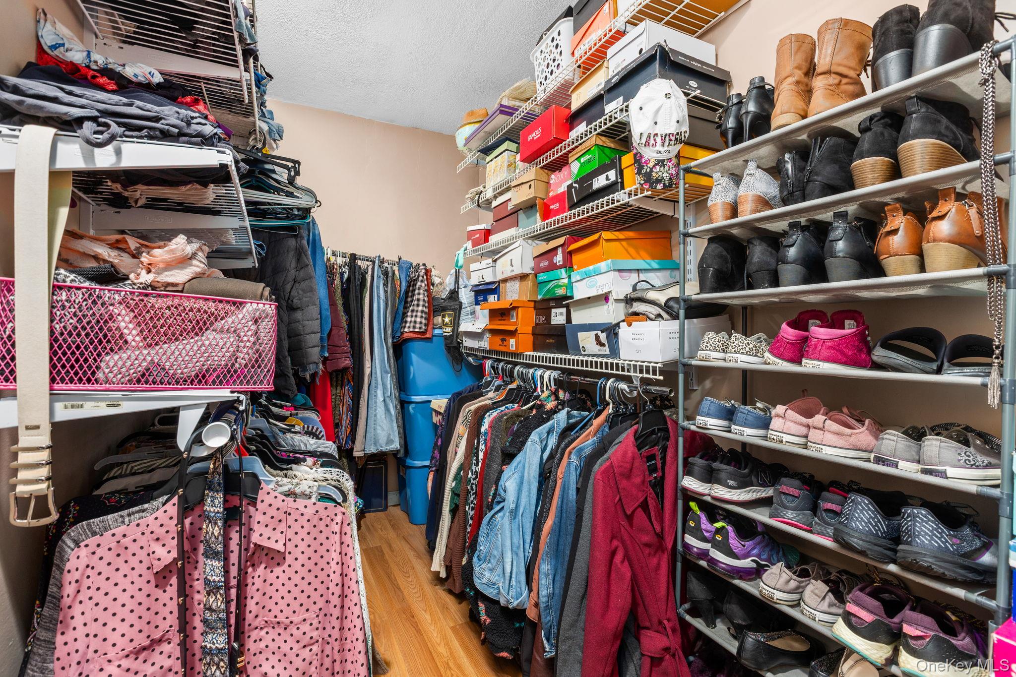 104 Riley Road New Windsor, NY 12553 - Photo 27 of 35 a view of walk in closet with clothes and shoes