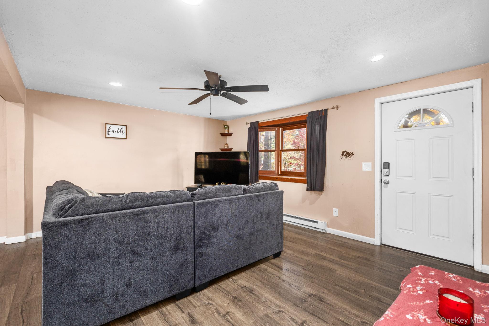104 Riley Road New Windsor, NY 12553 - Photo 3 of 35 a living room with furniture and a flat screen tv
