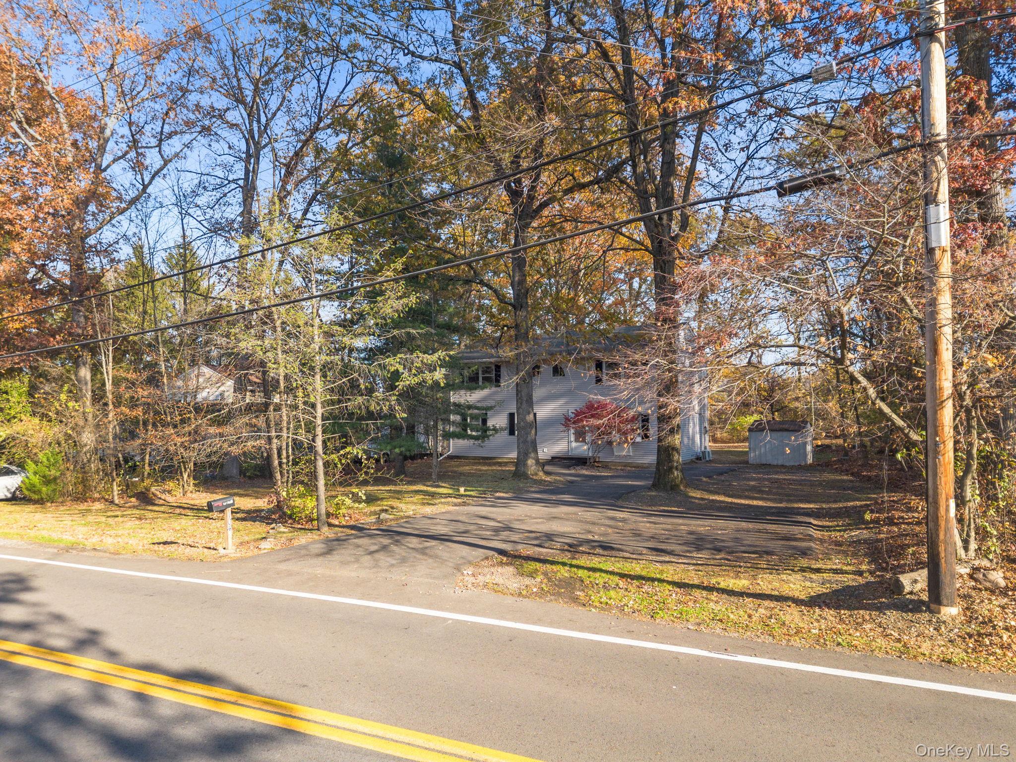 104 Riley Road New Windsor, NY 12553 - Photo 32 of 35 a view of the house with a large tree