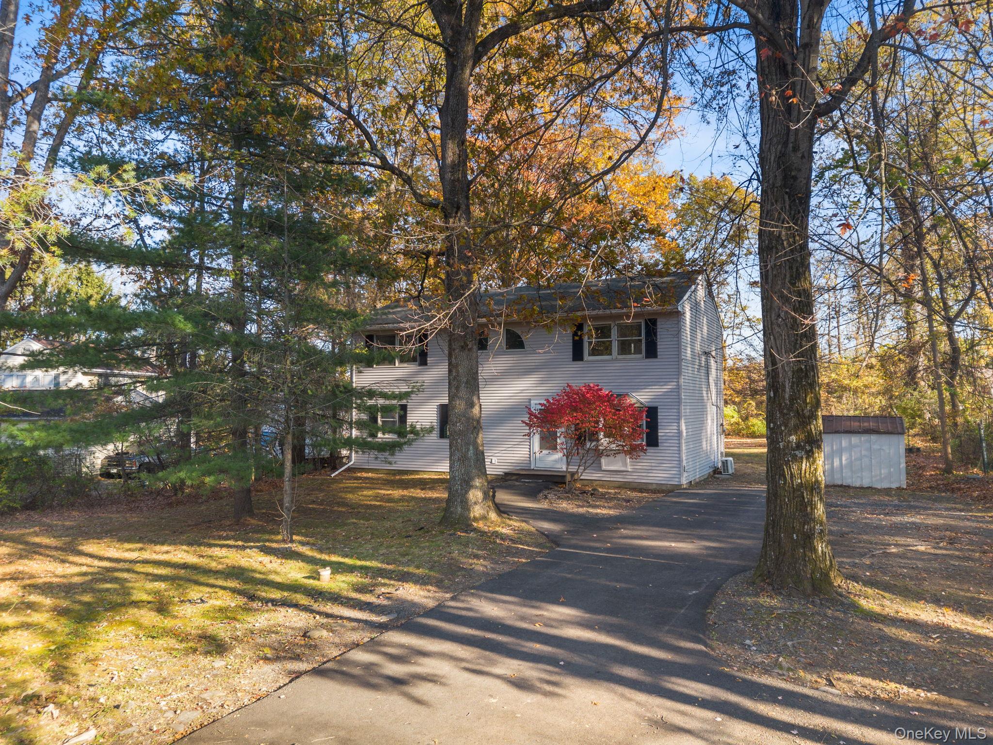 104 Riley Road New Windsor, NY 12553 - Photo 34 of 35 a street view with large trees