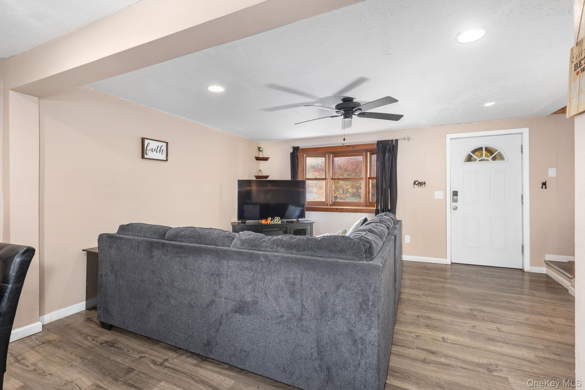 104 Riley Road New Windsor, NY 12553 - Photo 4 of 35 a living room with furniture and a flat screen tv