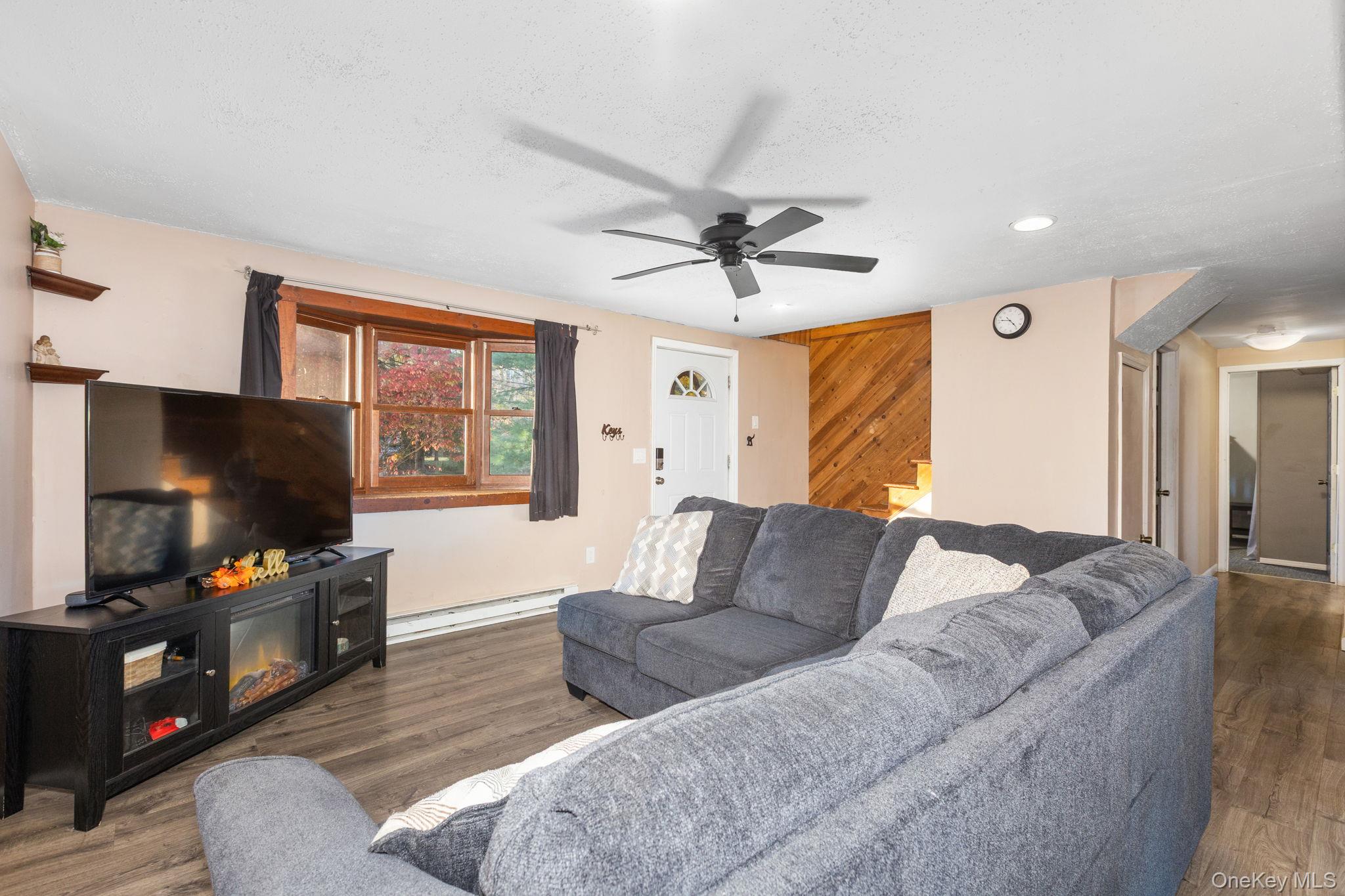 104 Riley Road New Windsor, NY 12553 - Photo 5 of 35 a living room with furniture and a flat screen tv