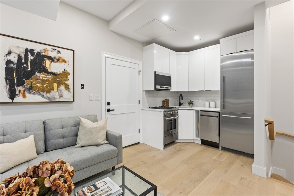 166 Salem Street, Unit A Boston, MA 02113 - Photo 4 of 16 a kitchen with a refrigerator and a sink