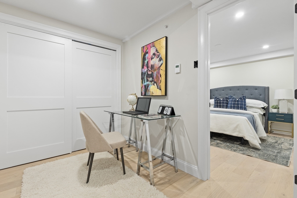 166 Salem Street, Unit A Boston, MA 02113 - Photo 7 of 16 a bedroom with a bed and a chair