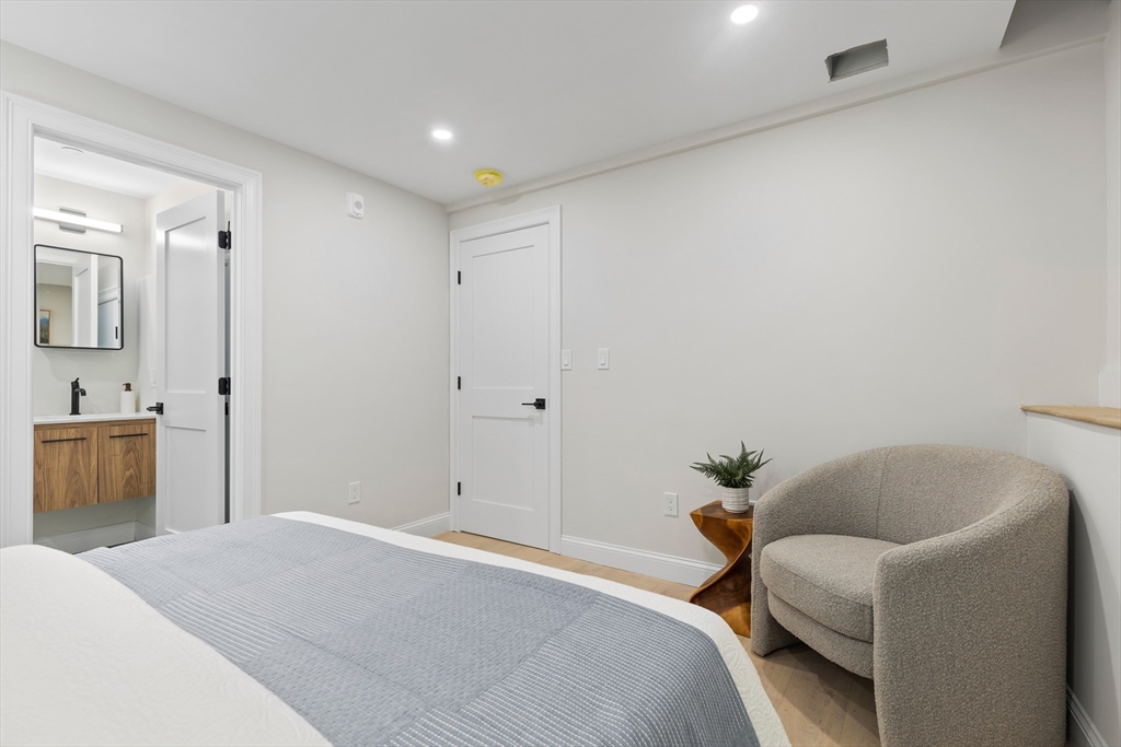 166 Salem Street, Unit A Boston, MA 02113 - Photo 10 of 16 a bedroom with a bed and a couch