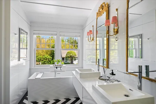 a bathroom with a sink and a large mirror