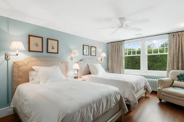 a bedroom with a large bed and a couch