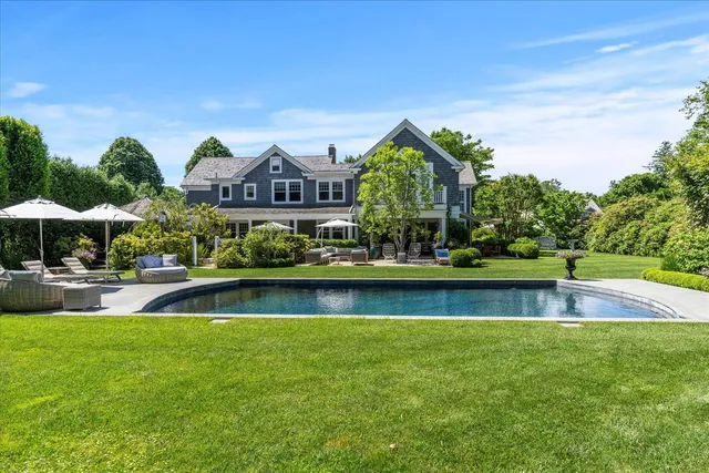 a view of swimming pool and outdoor seating