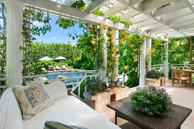 a view of a chairs and table in a patio