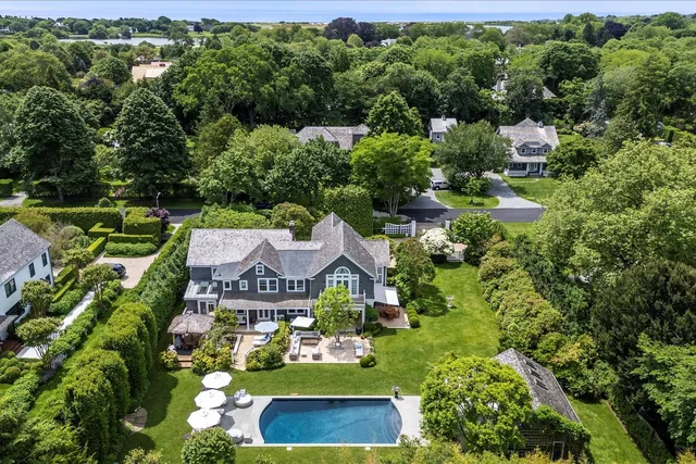 an aerial view of a house with a garden