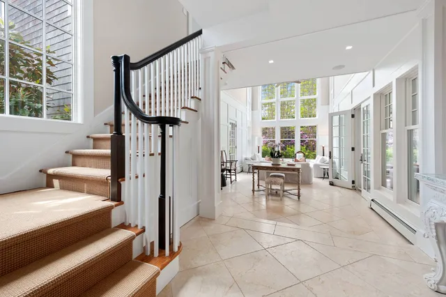 a view of a livingroom with furniture and a potted plant