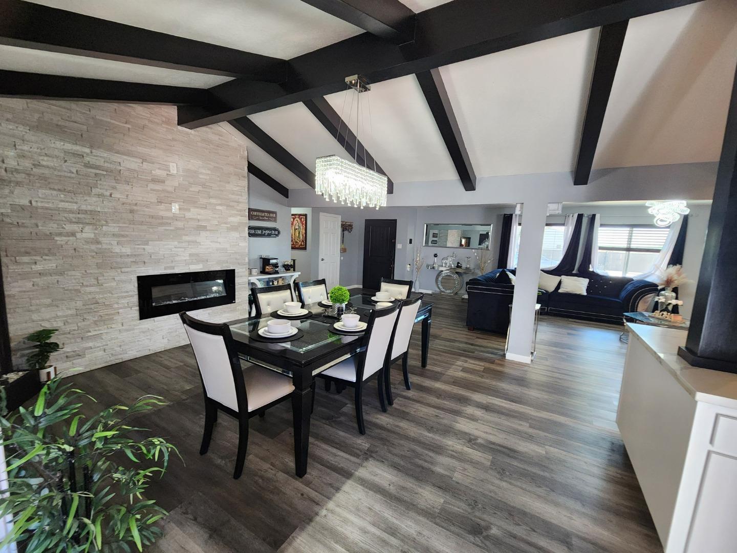 601 Weyer Road Modesto, CA 95357 - Photo 11 of 27 a view of a dining room with furniture and wooden floor