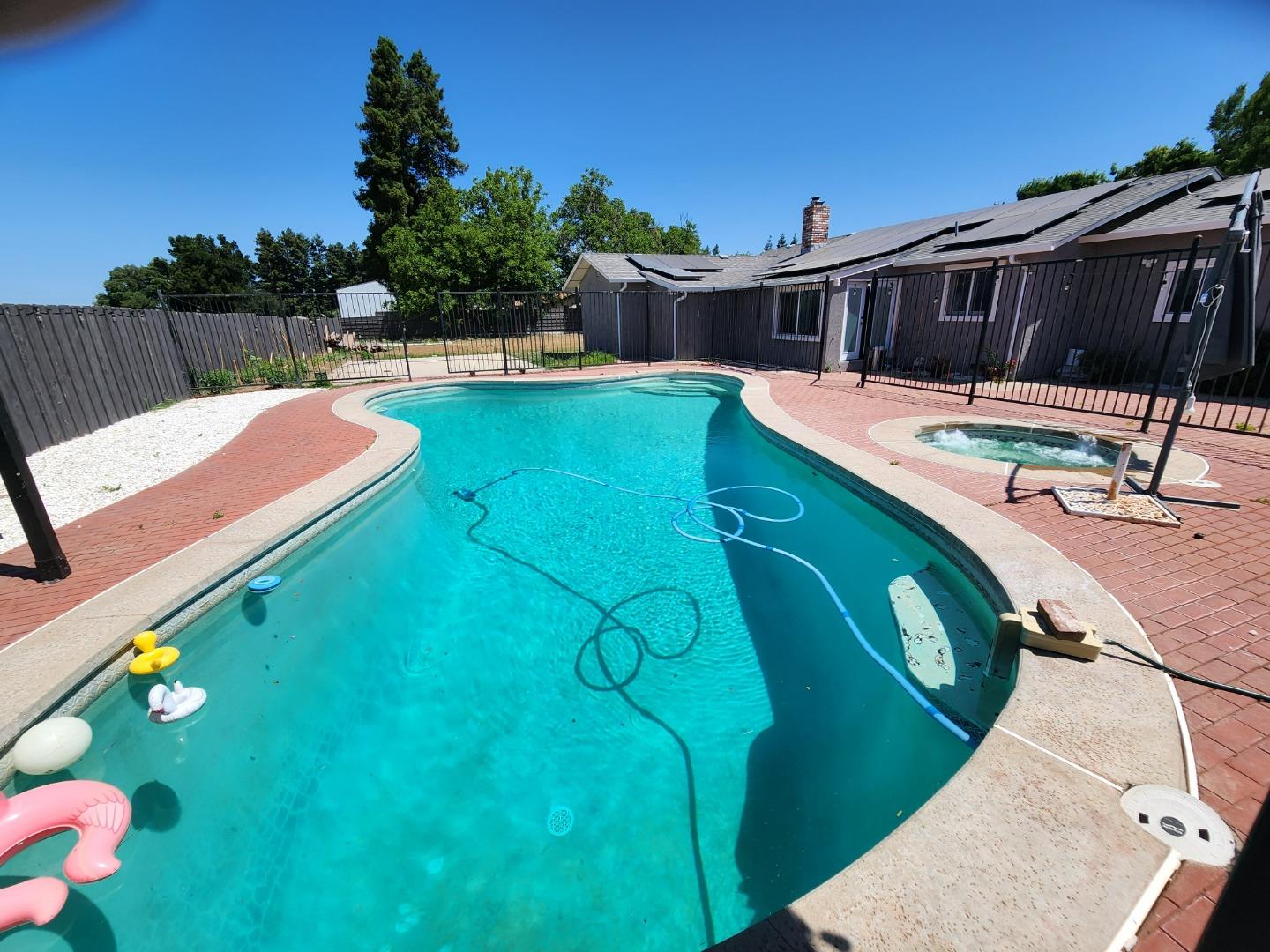 601 Weyer Road Modesto, CA 95357 - Photo 24 of 27 a view of a swimming pool with chairs