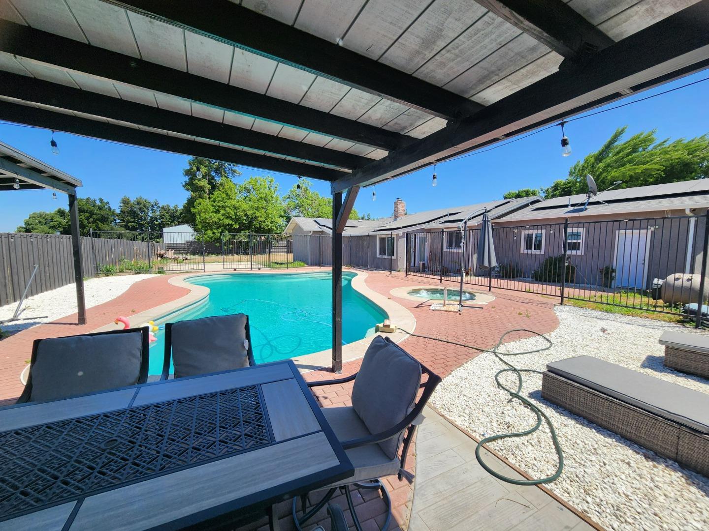 601 Weyer Road Modesto, CA 95357 - Photo 26 of 27 a view of swimming pool with seating area and furniture