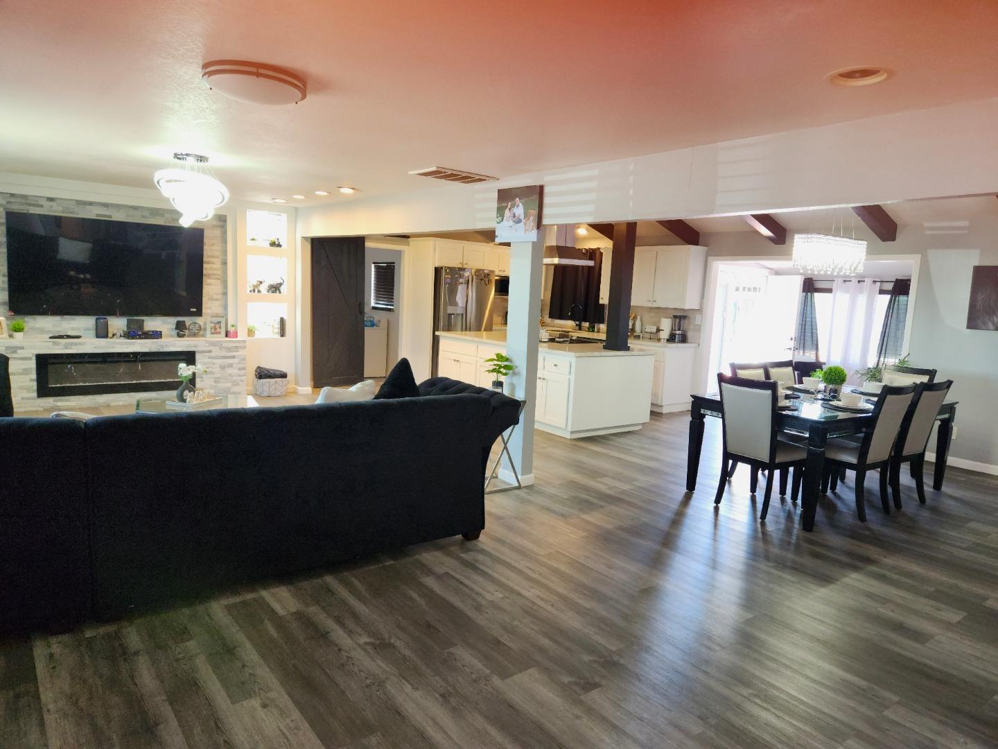 601 Weyer Road Modesto, CA 95357 - Photo 3 of 27 a living room with stainless steel appliances furniture and a flat screen tv
