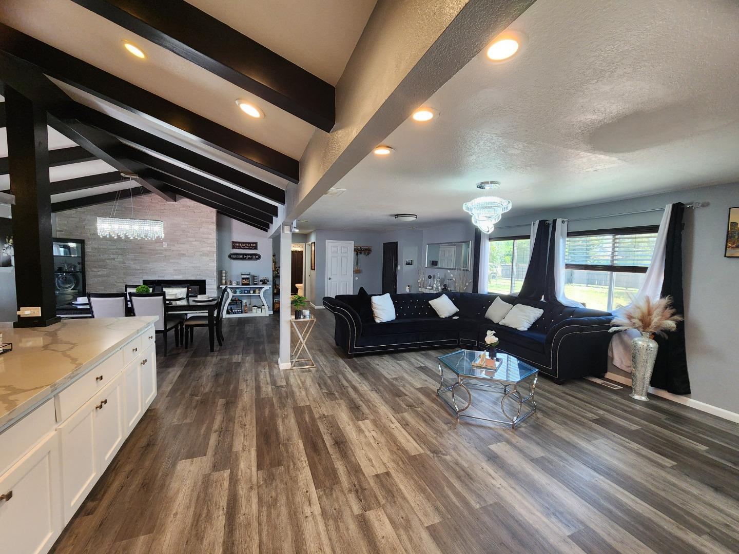 601 Weyer Road Modesto, CA 95357 - Photo 5 of 27 a living room with furniture and a wooden floor