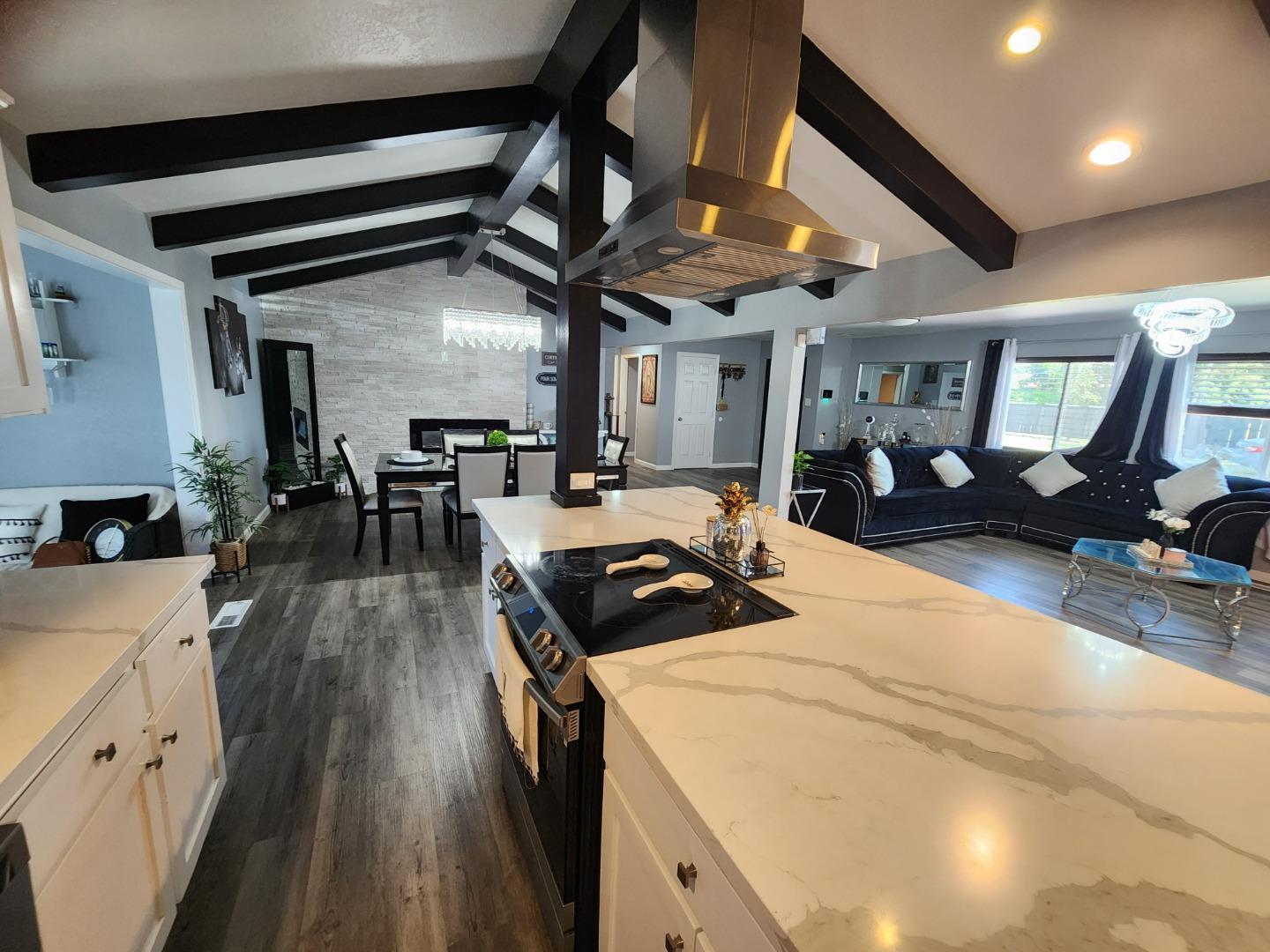 601 Weyer Road Modesto, CA 95357 - Photo 8 of 27 a kitchen with stainless steel appliances granite countertop lots of counter top space