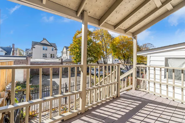 a view of a large building from a balcony