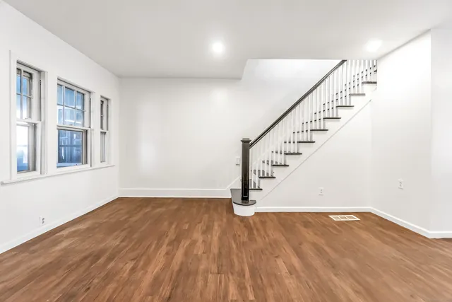 a view of entryway with wooden floor