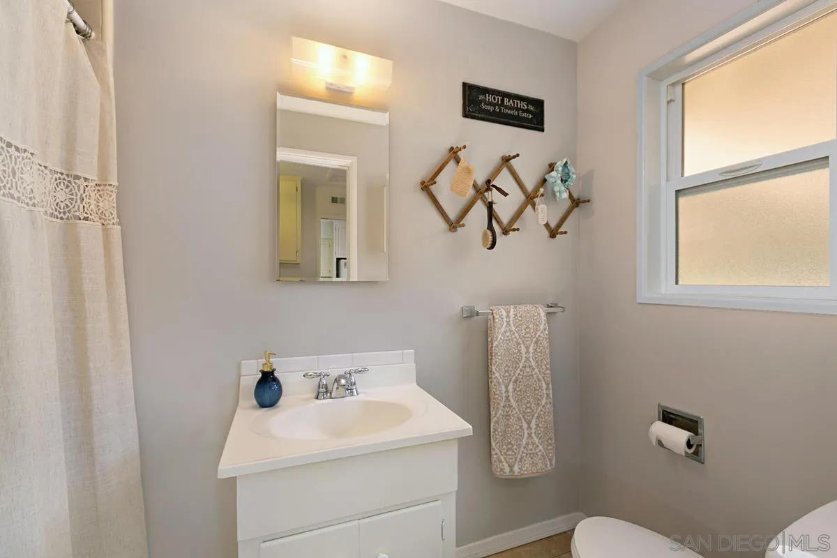 11615 Westridge Place Lakeside, CA 92040 - Photo 14 of 29 a bathroom with a sink mirror and toilet