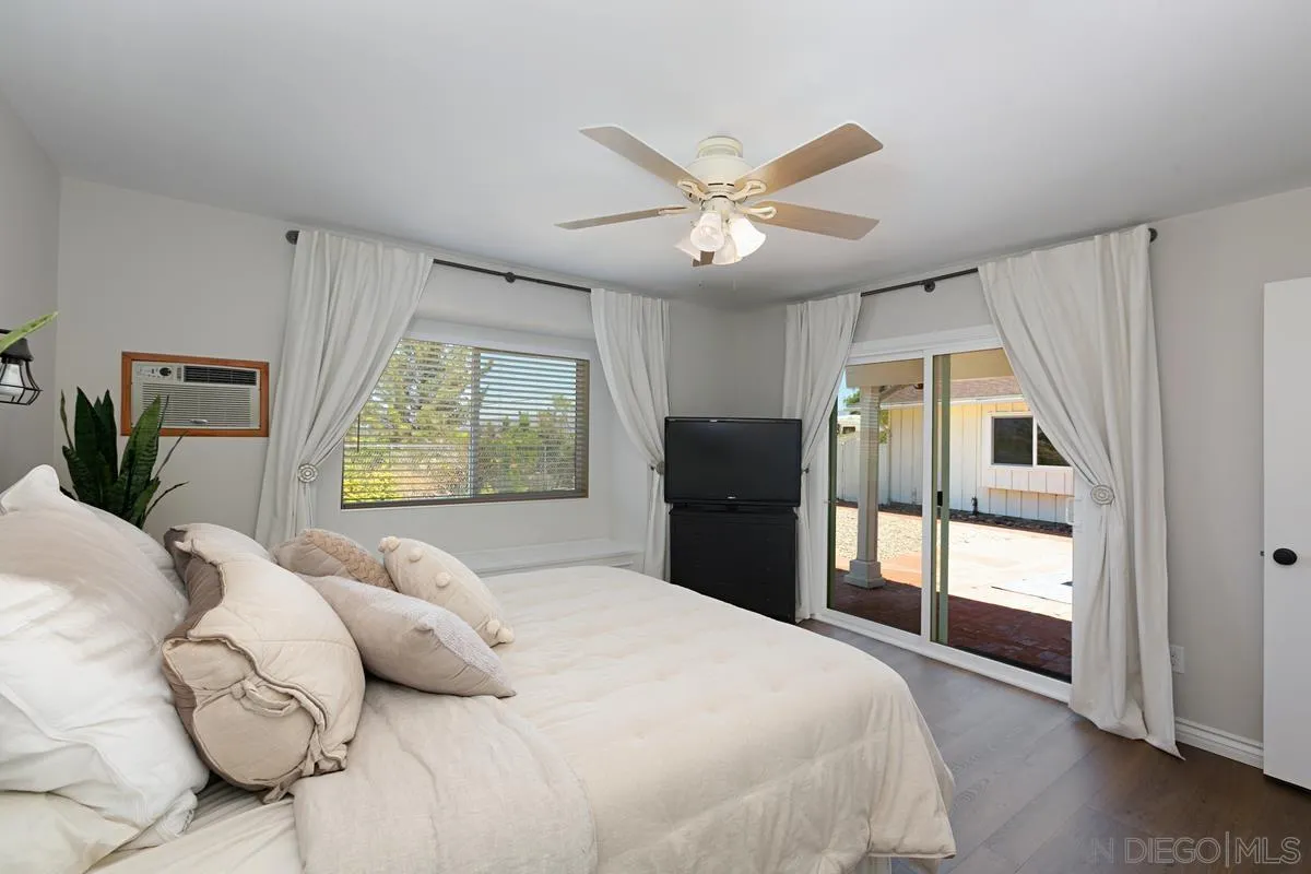 11615 Westridge Place Lakeside, CA 92040 - Photo 19 of 29 a bedroom with a large bed and a window